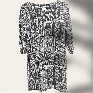 Timeless sweater dress with a unique pattern. Dress it up or down! Like new!